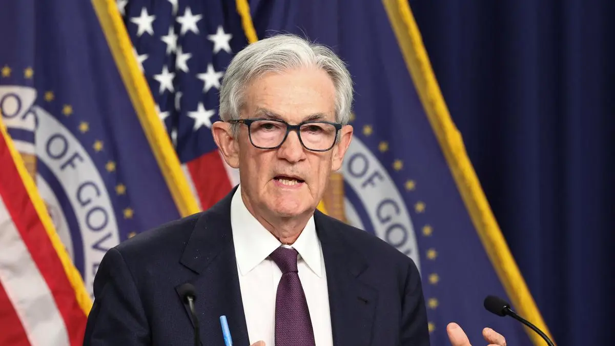 Fed holds rates steady, flags rising risks of inflation and unemployment